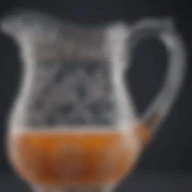 Close-up of a glass creamer pitcher showcasing its intricate design