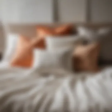 Variety of textures in large toss pillows arranged on a bed