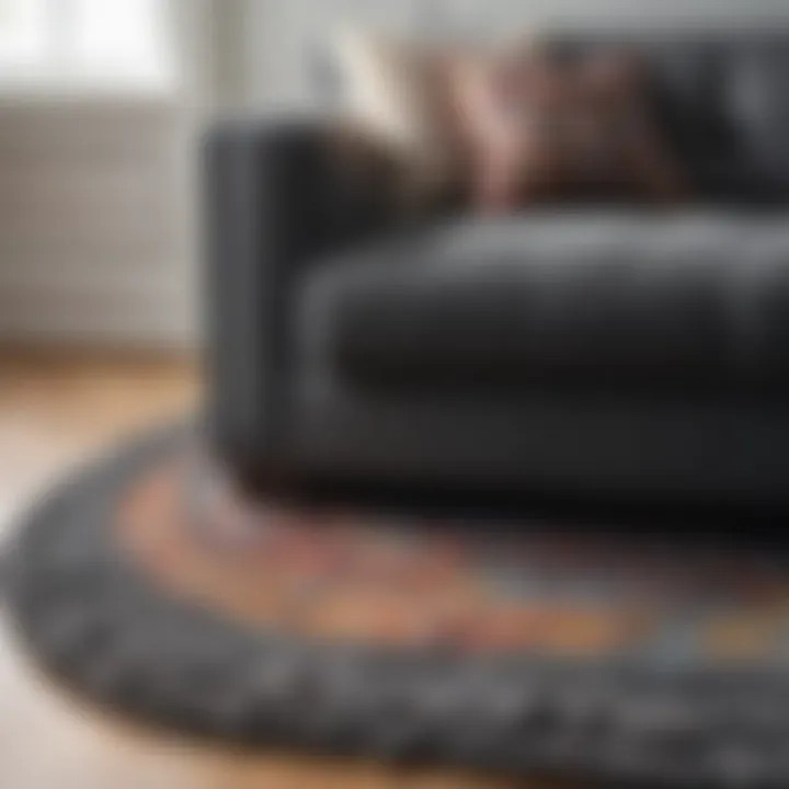 Close-up of a textured rug complementing a dark grey sofa, highlighting materials and craftsmanship